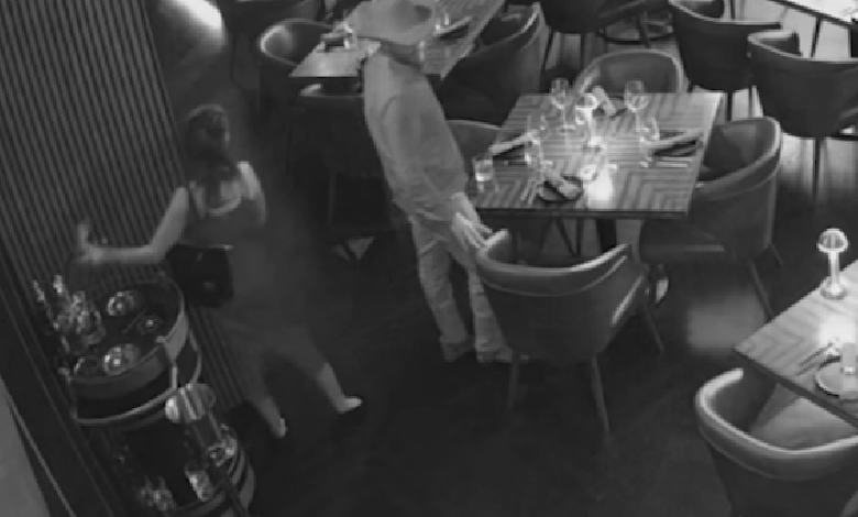 Couple allegedly caught on video swiping K bottle from table in brazen restaurant theft Couple allegedly caught on video swiping K bottle from table in brazen restaurant theft