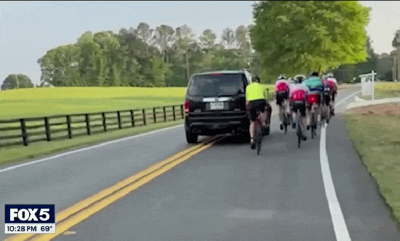 Driver smirks in mugshot after allegedly hitting group of cyclists in caught-on-camera road rage Driver smirks in mugshot after allegedly hitting group of cyclists in caught-on-camera road rage