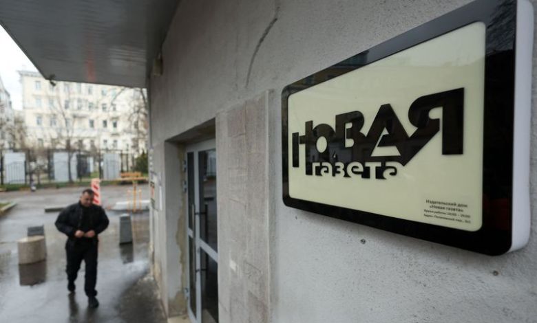 Masked security agents raid Russian newspaper in Moscow and arrest journalist Masked security agents raid Russian newspaper in Moscow and arrest journalist
