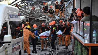 Philippine rescuers racing against time a day after deadly building collapse Philippine rescuers racing against time a day after deadly building collapse