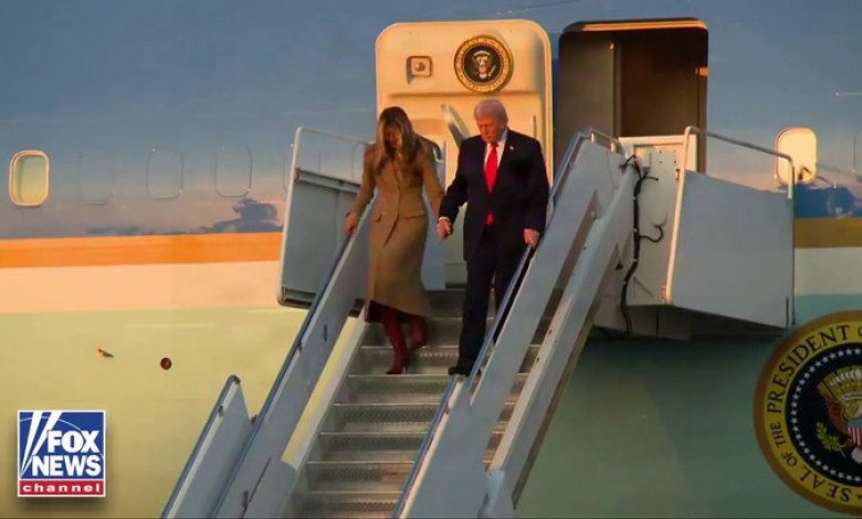 Trump Holds On to Melania for Dear Life While Descending AF1 Stairs Trump Holds On to Melania for Dear Life While Descending AF1 Stairs