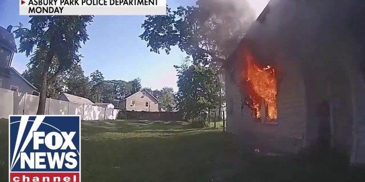 CAUGHT ON CAMERA: Watch child rescued from burning home CAUGHT ON CAMERA: Watch child rescued from burning home
