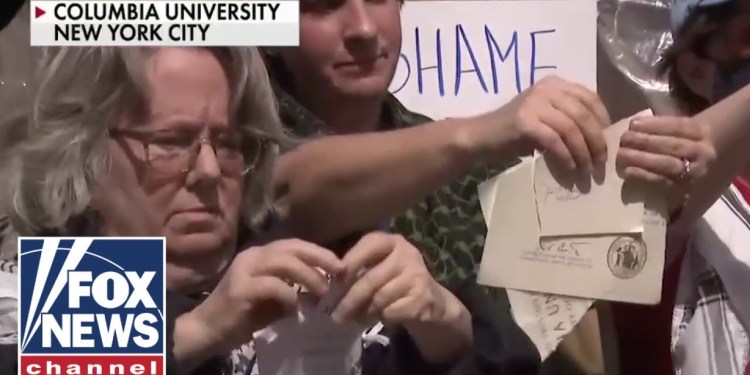 DITCHING DEGREES: Columbia alum rip up diplomas in protest of talks with WH DITCHING DEGREES: Columbia alum rip up diplomas in protest of talks with WH