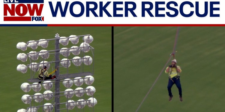 VIDEO: Worker rescued from high up on stadium lights VIDEO: Worker rescued from high up on stadium lights