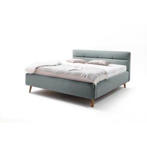 Modrá čalouněná dvoulůžková postel s úložným prostorem a s roštem 180×200 cm Lotte – Meise Möbel