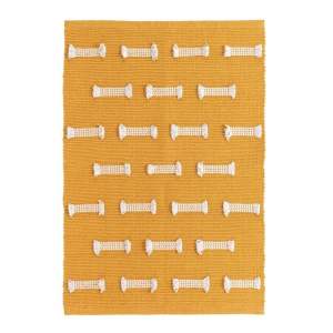 Okrově žlutý pratelný koberec 50×80 cm Juline – douceur d’intérieur