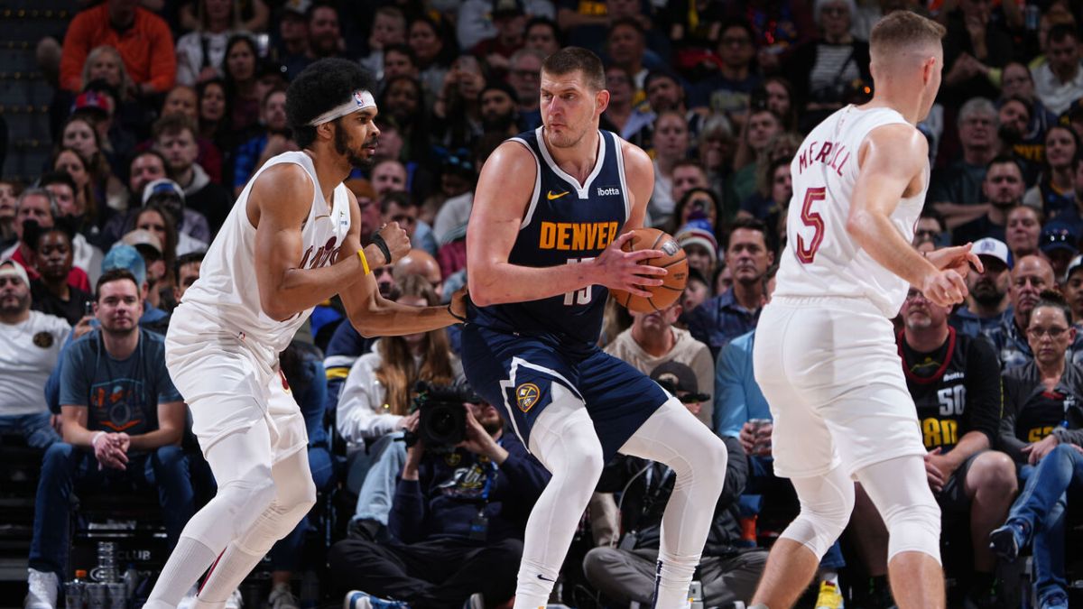 Jokic’s triple-double leads Nuggets to victory over Cavs and secures playoff berth. Jokic’s triple-double leads Nuggets to victory over Cavs and secures playoff berth.