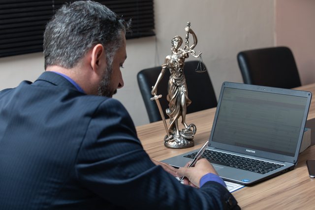 A legal professional writing. Photo by Advocate Aguilar. A legal professional writing. Photo by Advocate Aguilar.