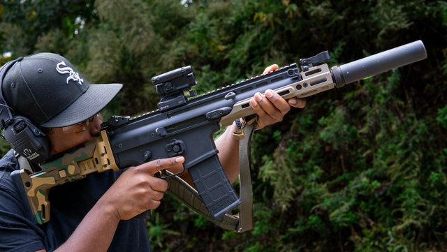Demonstration of a silencer and hearing protection. Photo by Martin Podsiad. Demonstration of a silencer and hearing protection. Photo by Martin Podsiad.