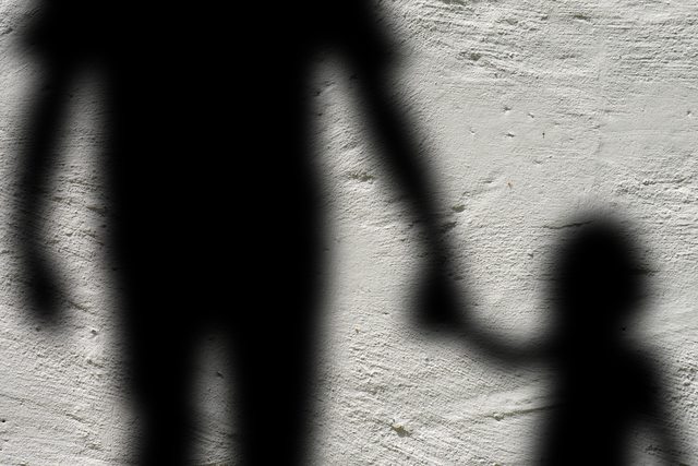 Shadow of a man with a child. Shadow of a man with a child.