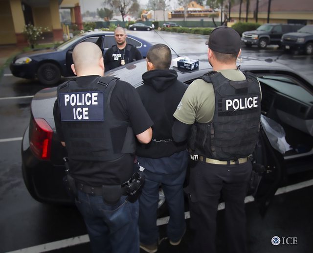 File photo of an arrest by ICE police officers. File photo of an arrest by ICE police officers.