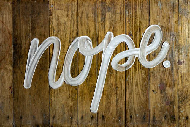 Grafitti of the word nope on a wooden desk by Daniel Herron. Grafitti of the word nope on a wooden desk by Daniel Herron.