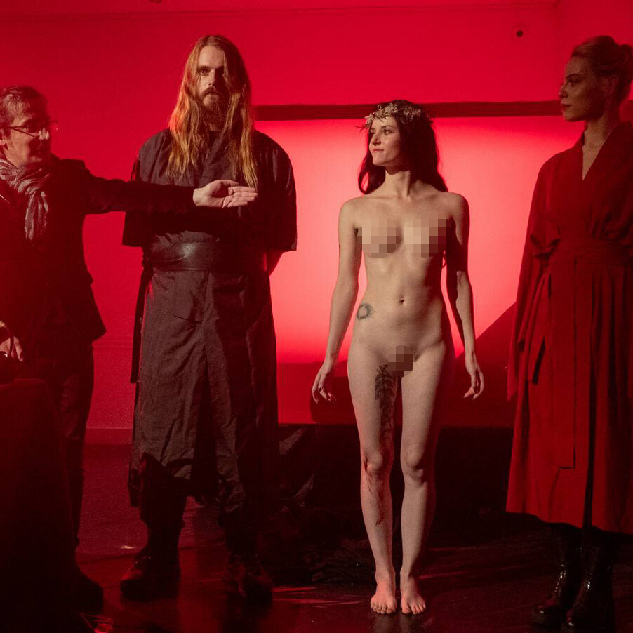 A naked girl lays an egg in front of guests. A Latvian artist organizes a shocking tea party