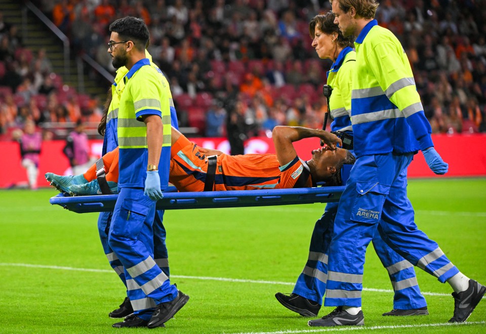 Nathan Ake looks on brink of tears as he's stretchered off with horror injury Nathan Ake looks on brink of tears as he's stretchered off with horror injury
