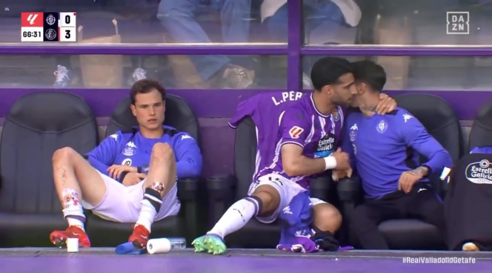 Shocking moment footballer punches team-mate in rage before he's restrained Shocking moment footballer punches team-mate in rage before he's restrained