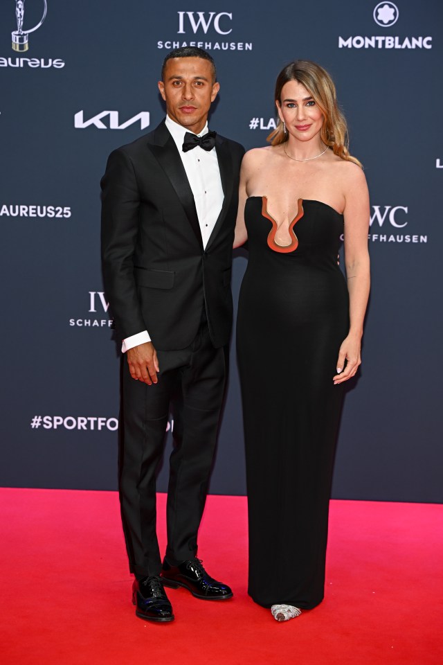 Ex-Liverpool star Thiago's wife steals show as she goes braless in daring dress Ex-Liverpool star Thiago's wife steals show as she goes braless in daring dress