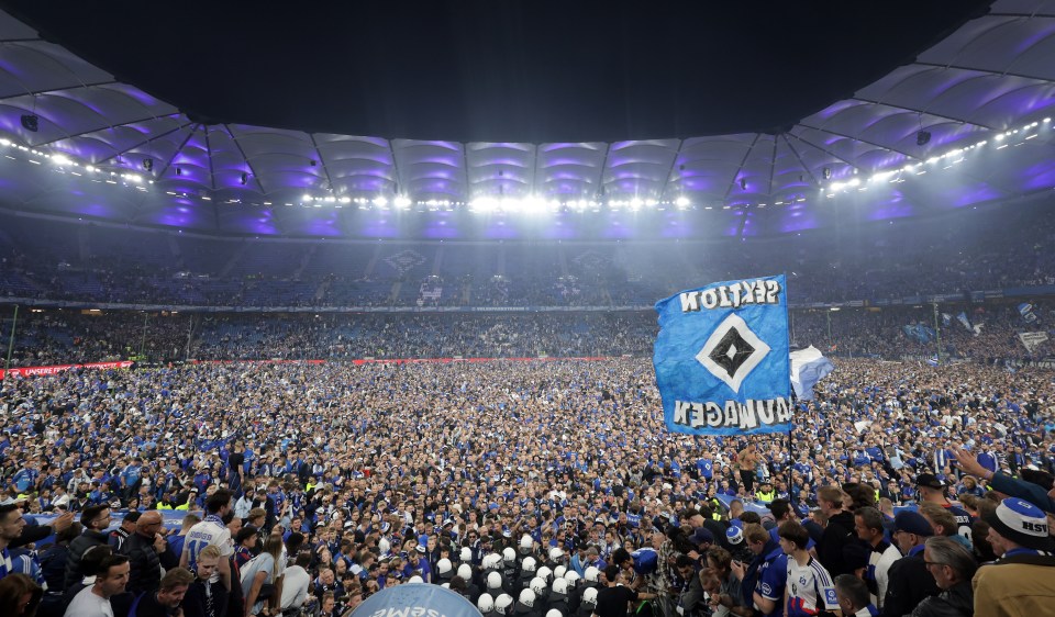 At least 25 rushed to hospital after fans storm pitch as club wins promotion At least 25 rushed to hospital after fans storm pitch as club wins promotion
