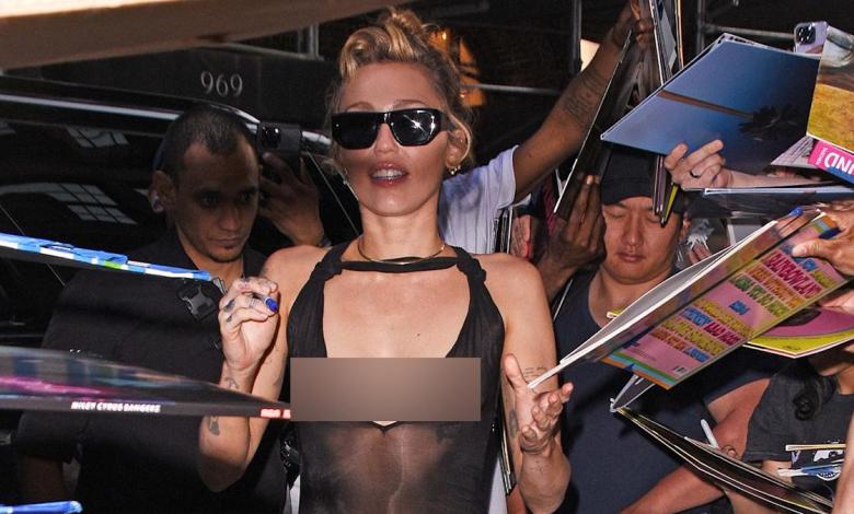 Miley Cyrus stuns her fans with a daring dress during the signing of an album in New York Miley Cyrus stuns her fans with a daring dress during the signing of an album in New York
