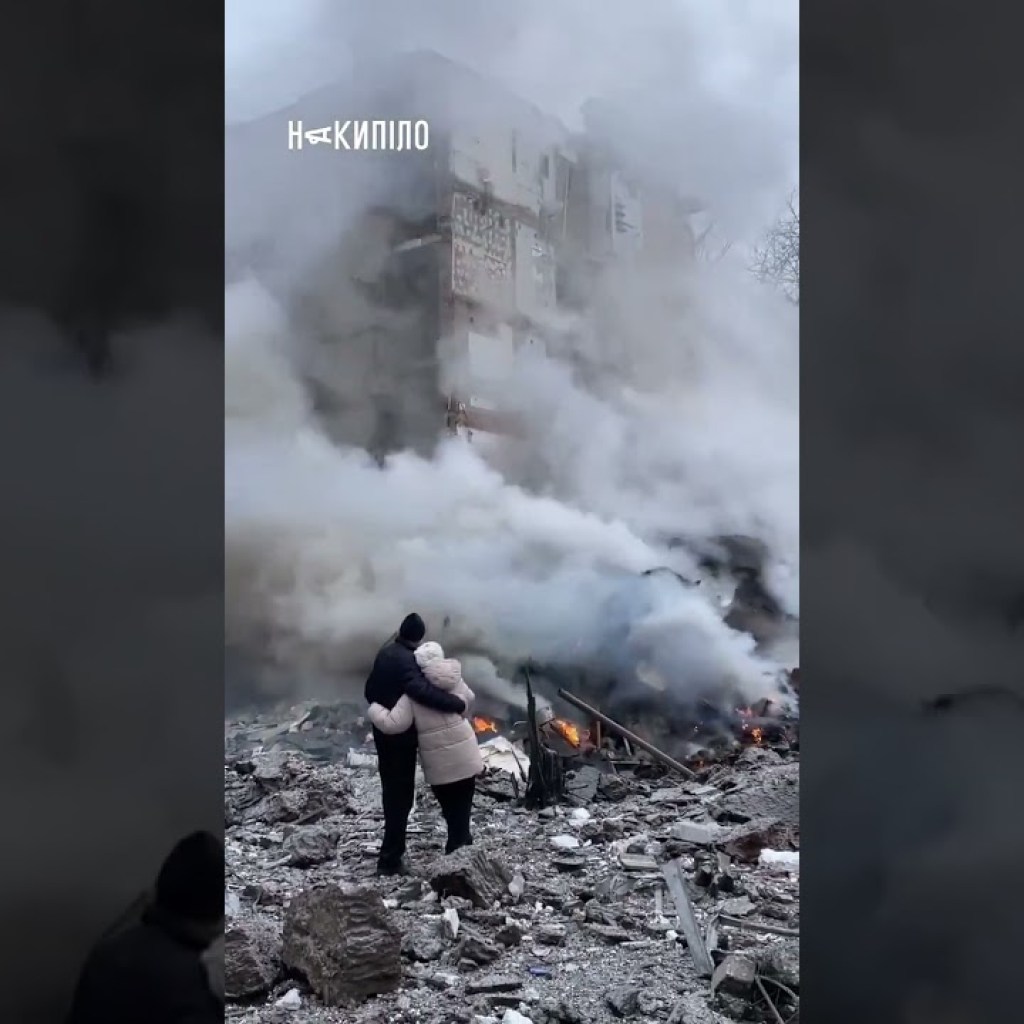Heartbreaking images of Ukrainian locals looking at burning remains of their home in Kharkiv Heartbreaking images of Ukrainian locals looking at burning remains of their home in Kharkiv