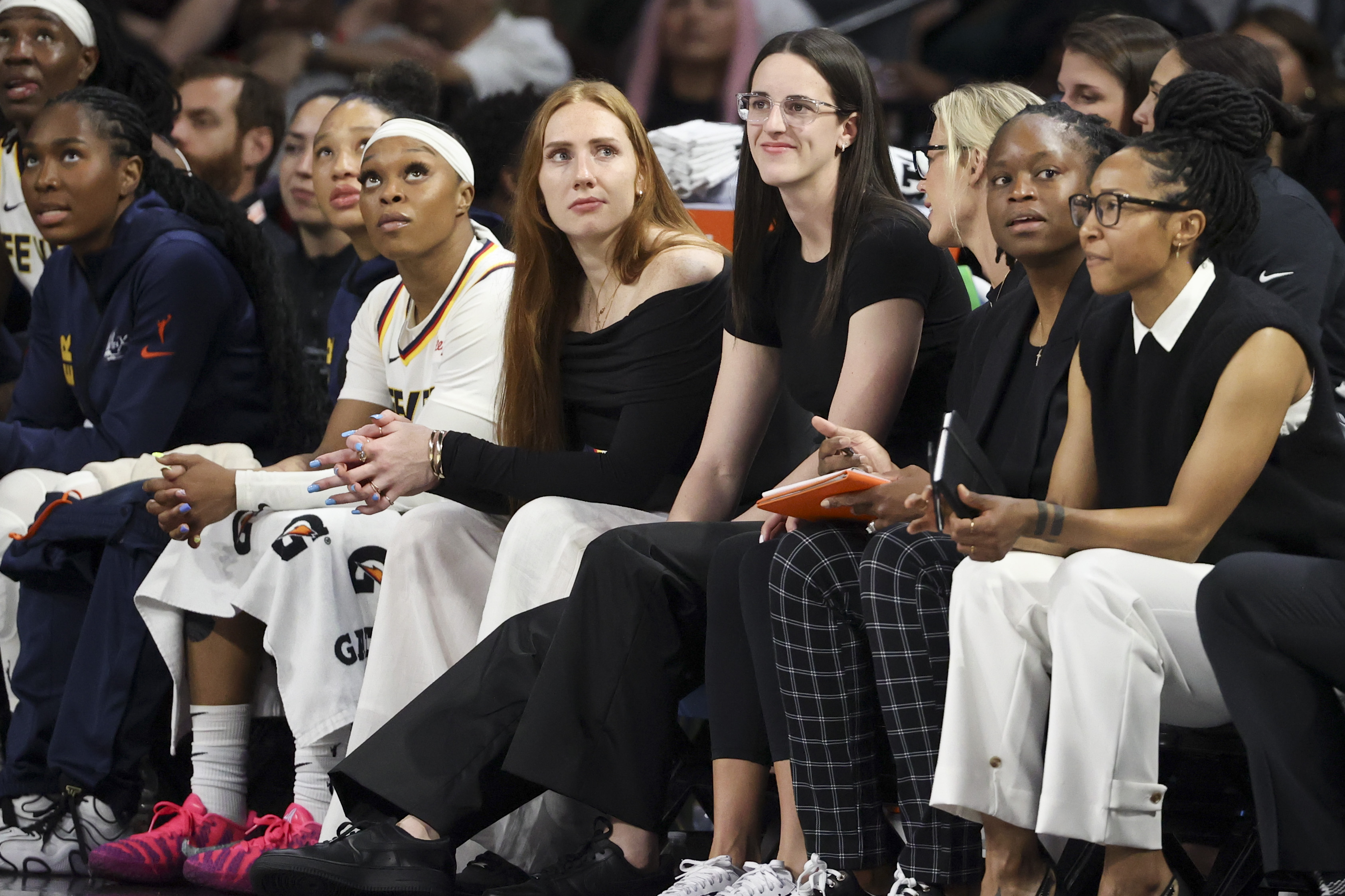 LAS VEGAS, NEVADA - SEPTEMBER 23: Caitlin Clark #22 of the Indiana Fever looks on from the bench in the third quarter of Game Two of the 2025 WNBA Playoffs semifinals against the Las Vegas Aces at Michelob ULTRA Arena on September 23, 2025 in Las Vegas, Nevada. NOTE TO USER: User expressly acknowledges and agrees that, by downloading and or using this photograph, User is consenting to the terms and conditions of the Getty Images License Agreement. (Photo by Ian Maule/Getty Images)