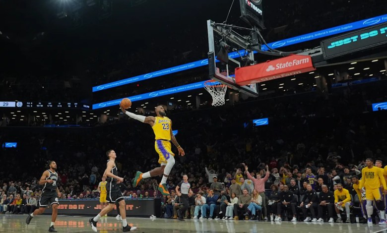James and Doncic help Lakers rout Nets 125-109 in Austin Reaves’ return from injury James and Doncic help Lakers rout Nets 125-109 in Austin Reaves’ return from injury
