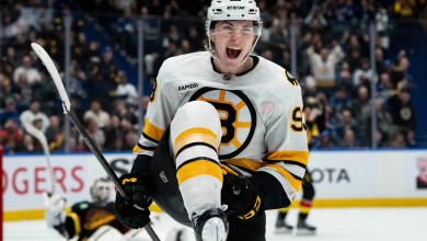 Minten scores twice in huge homecoming to lift Bruins over Canucks 3-2 in OT Minten scores twice in huge homecoming to lift Bruins over Canucks 3-2 in OT