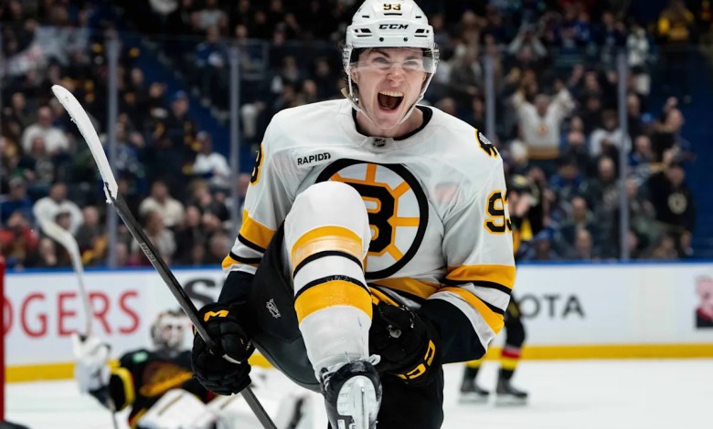 Minten scores twice in huge homecoming to lift Bruins over Canucks 3-2 in OT Minten scores twice in huge homecoming to lift Bruins over Canucks 3-2 in OT