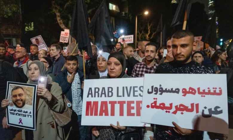 Tens of thousands rally in Tel Aviv over violence in Arab society, call for government action Tens of thousands rally in Tel Aviv over violence in Arab society, call for government action