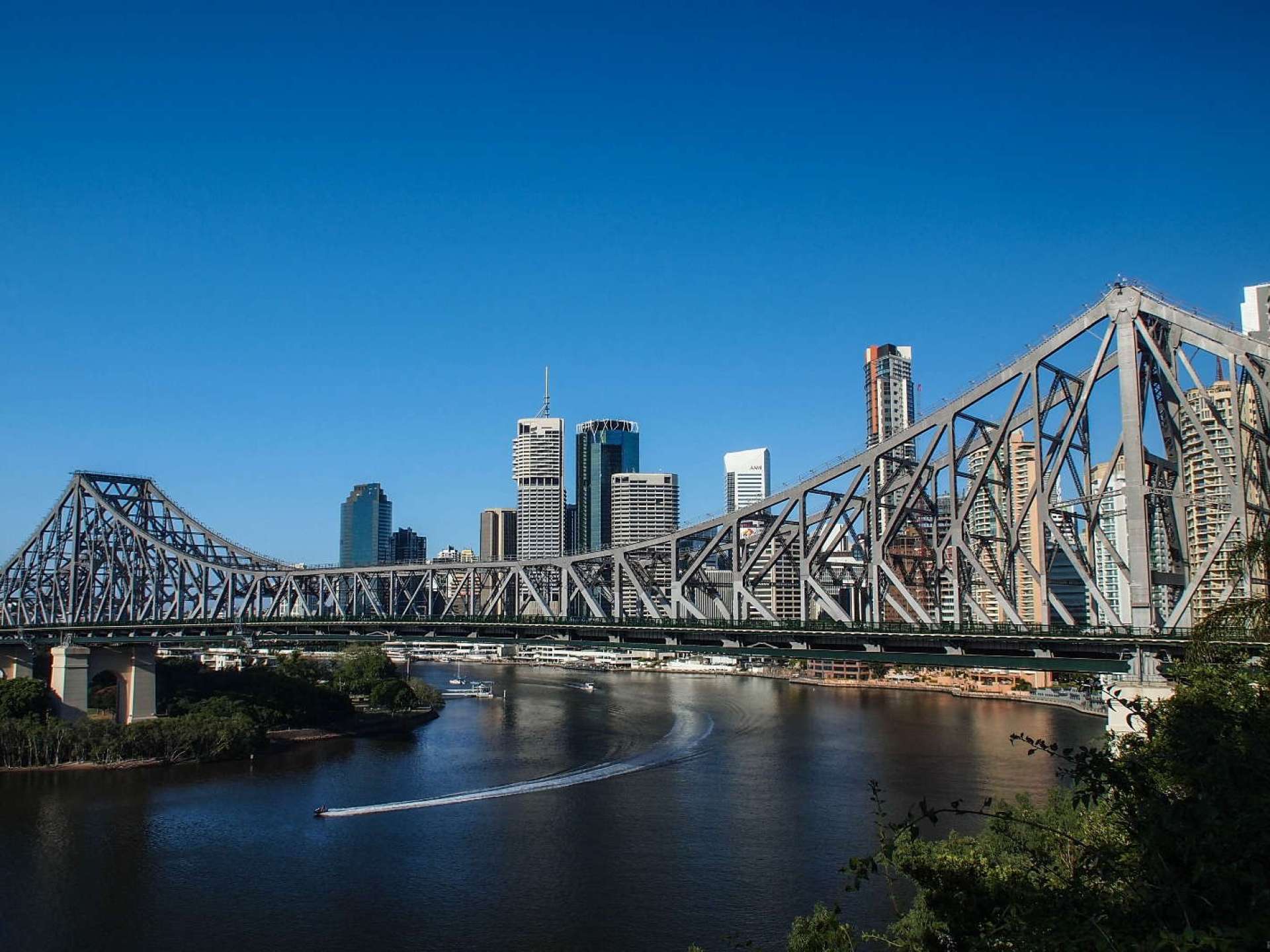 A scenic view of the iconic Story Bridge in Brisbane, showcasing the stunning skyline and vibrant atmosphere of the city. A scenic view of the iconic Story Bridge in Brisbane, showcasing the stunning skyline and vibrant atmosphere of the city.