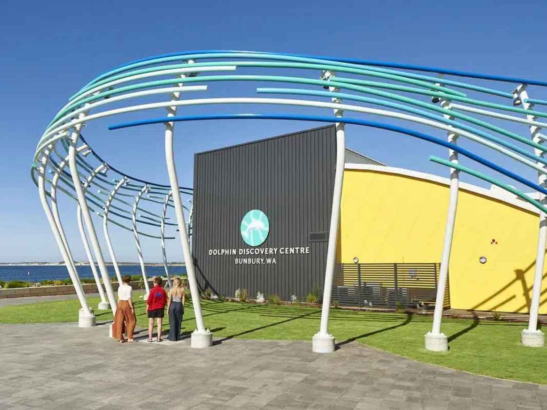 A view of the Bunbury Dolphin Discovery Centre showcasing dolphins and visitors enjoying the beautiful coastal setting. A view of the Bunbury Dolphin Discovery Centre showcasing dolphins and visitors enjoying the beautiful coastal setting.