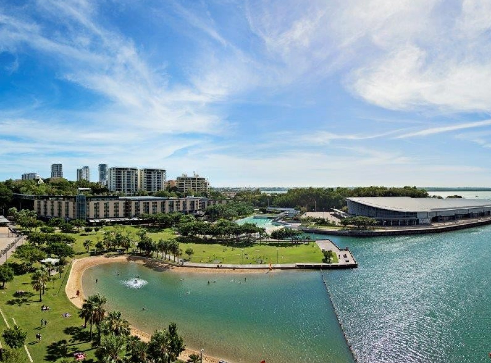 Scenic view of the vibrant Darwin Waterfront Precinct, featuring lush greenery and sparkling water against a clear blue sky. Scenic view of the vibrant Darwin Waterfront Precinct, featuring lush greenery and sparkling water against a clear blue sky.