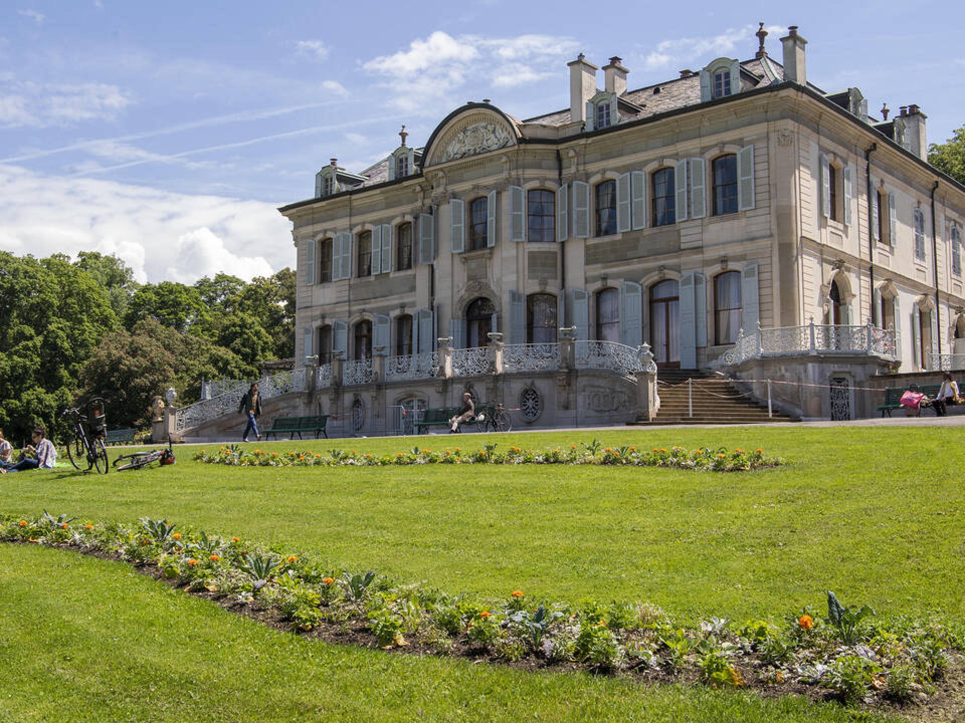 A scenic view of Parc des Franchises in Vernier, Switzerland, showcasing lush greenery and tranquil walking paths. A scenic view of Parc des Franchises in Vernier, Switzerland, showcasing lush greenery and tranquil walking paths.
