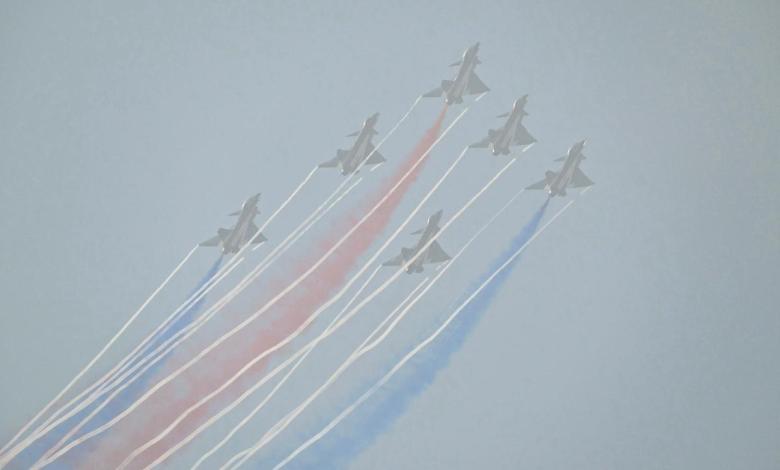 China’s biggest air show opened with a dazzling aerial display of its fighters, but crowds couldn’t see much through the smoke China’s biggest air show opened with a dazzling aerial display of its fighters, but crowds couldn’t see much through the smoke