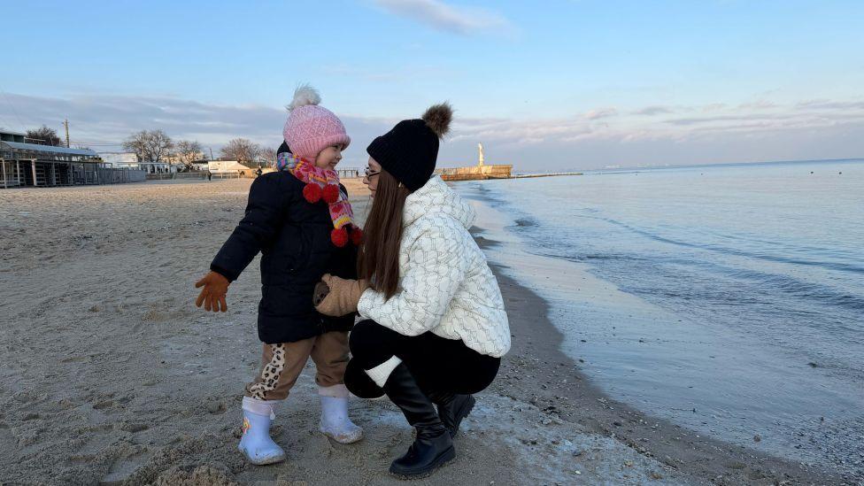 Under fire from the sea, families in Odesa try to escape Russian barrage Under fire from the sea, families in Odesa try to escape Russian barrage