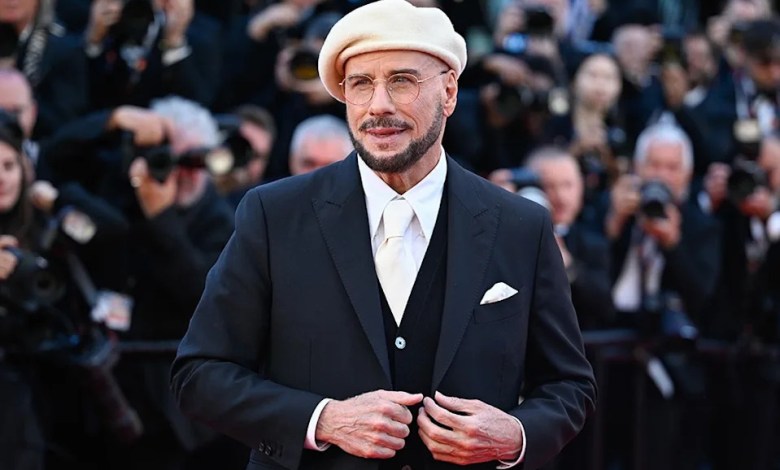 Travolta’s Cannes beret choice traces to directorial debut Travolta’s Cannes beret choice traces to directorial debut