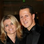 Michael Schumacher indicators F1 race helmet with assist of his spouse Corinna Michael Schumacher indicators F1 race helmet with assist of his spouse Corinna