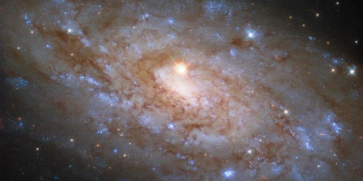 Nearby star photobombs portrait of a distant galaxy in new Hubble Telescope image Nearby star photobombs portrait of a distant galaxy in new Hubble Telescope image