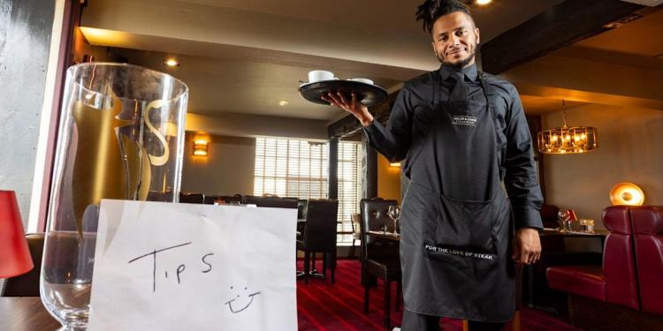 Restaurant waiter saved £8k in tips for three years to help GCSE students Restaurant waiter saved £8k in tips for three years to help GCSE students