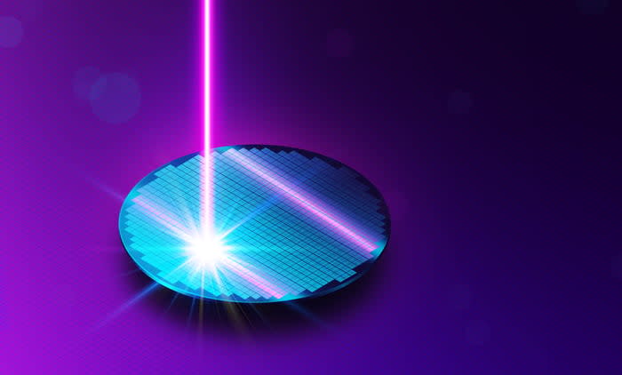 An artist's rendering of a semiconductor wafer being etched with a laser.