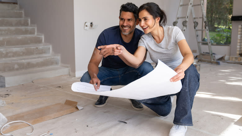 A young couple planning some home improvements