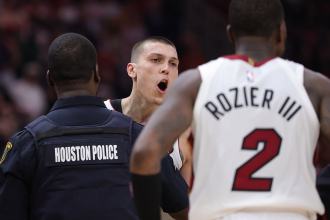 Amen Thompson throws Tyler Herro to the court, sparking fight in Heat's win over Rockets Amen Thompson throws Tyler Herro to the court, sparking fight in Heat's win over Rockets