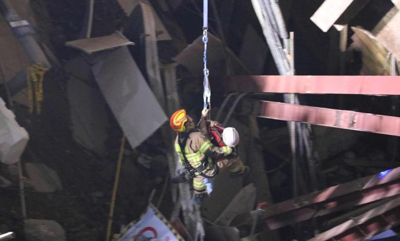 Workers rescued from the collapsed subway construction site after being trapped nearly 100 feet underground for 13 hours Workers rescued from the collapsed subway construction site after being trapped nearly 100 feet underground for 13 hours