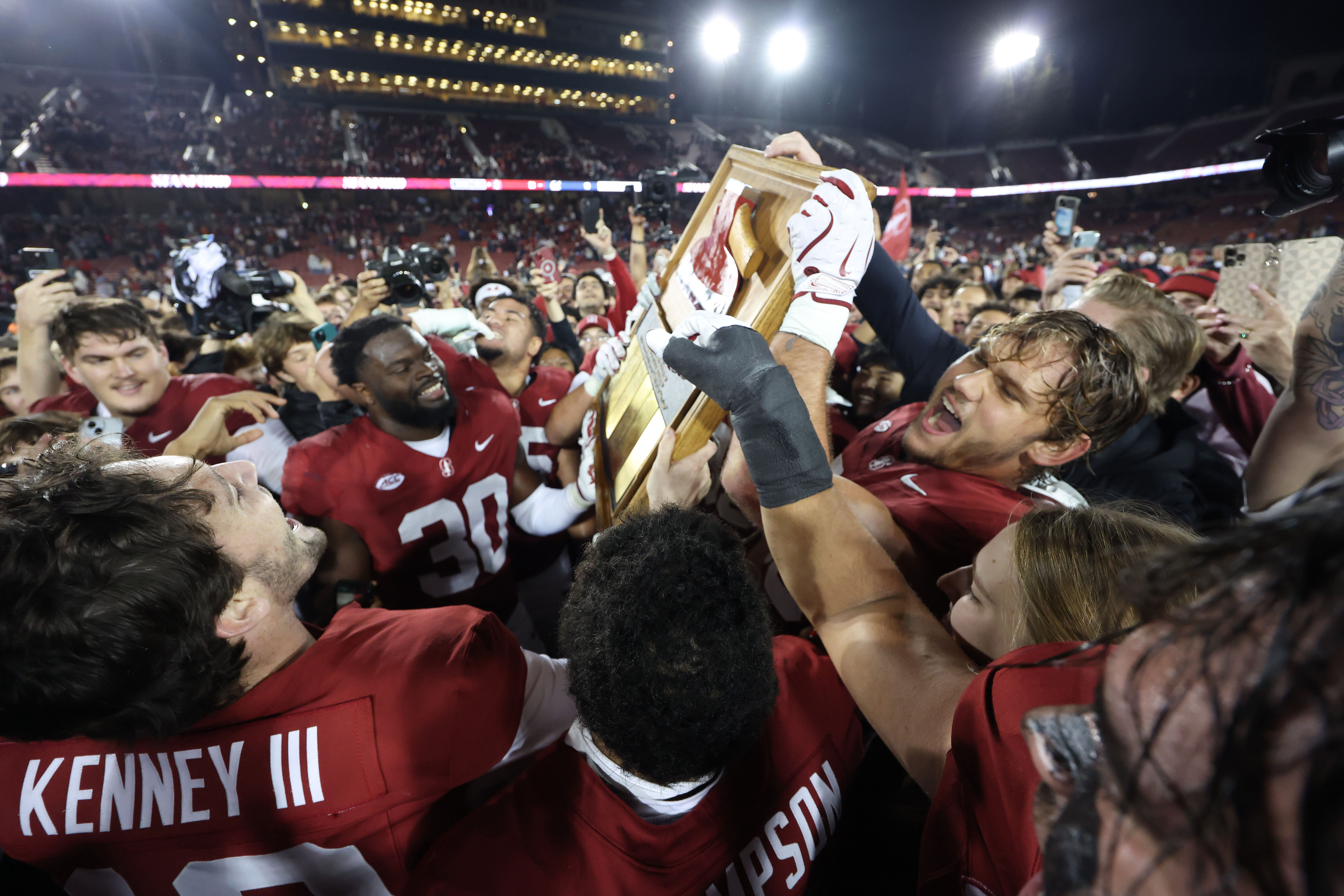 Stanford celebrates with the Stanford Axe after defeating California during an NCAA college football game in Stanford, Calif., Saturday, Nov. 22, 2025. (AP Photo/Jed Jacobsohn)