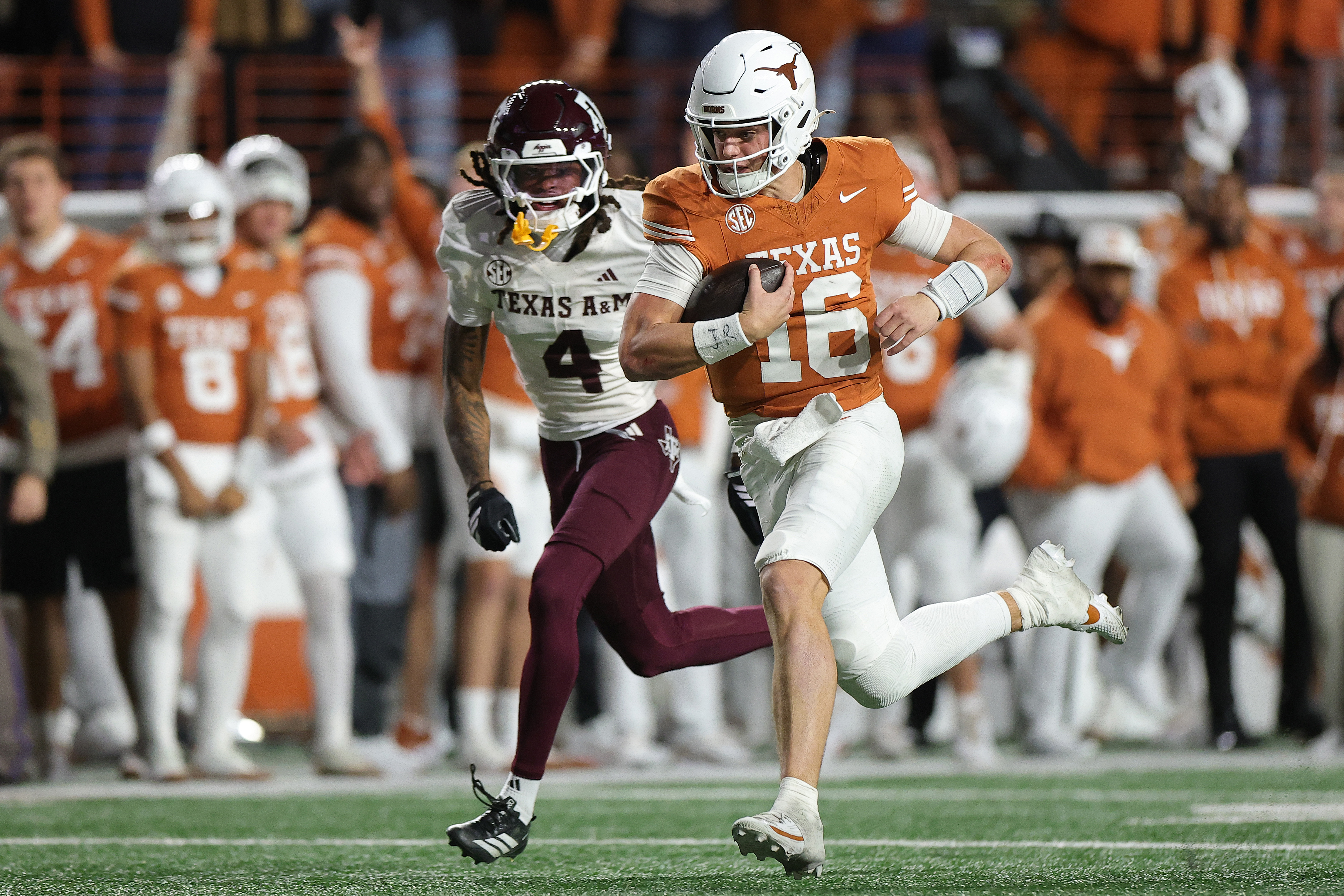 AUSTIN, TEXAS - NOVEMBER 28: Arch Manning #16 of the Texas Longhorns runs for a fourth quarter touchdown against the Texas A&M Aggies at Darrell K Royal-Texas Memorial Stadium on November 28, 2025 in Austin, Texas. (Photo by Alex Slitz/Getty Images)