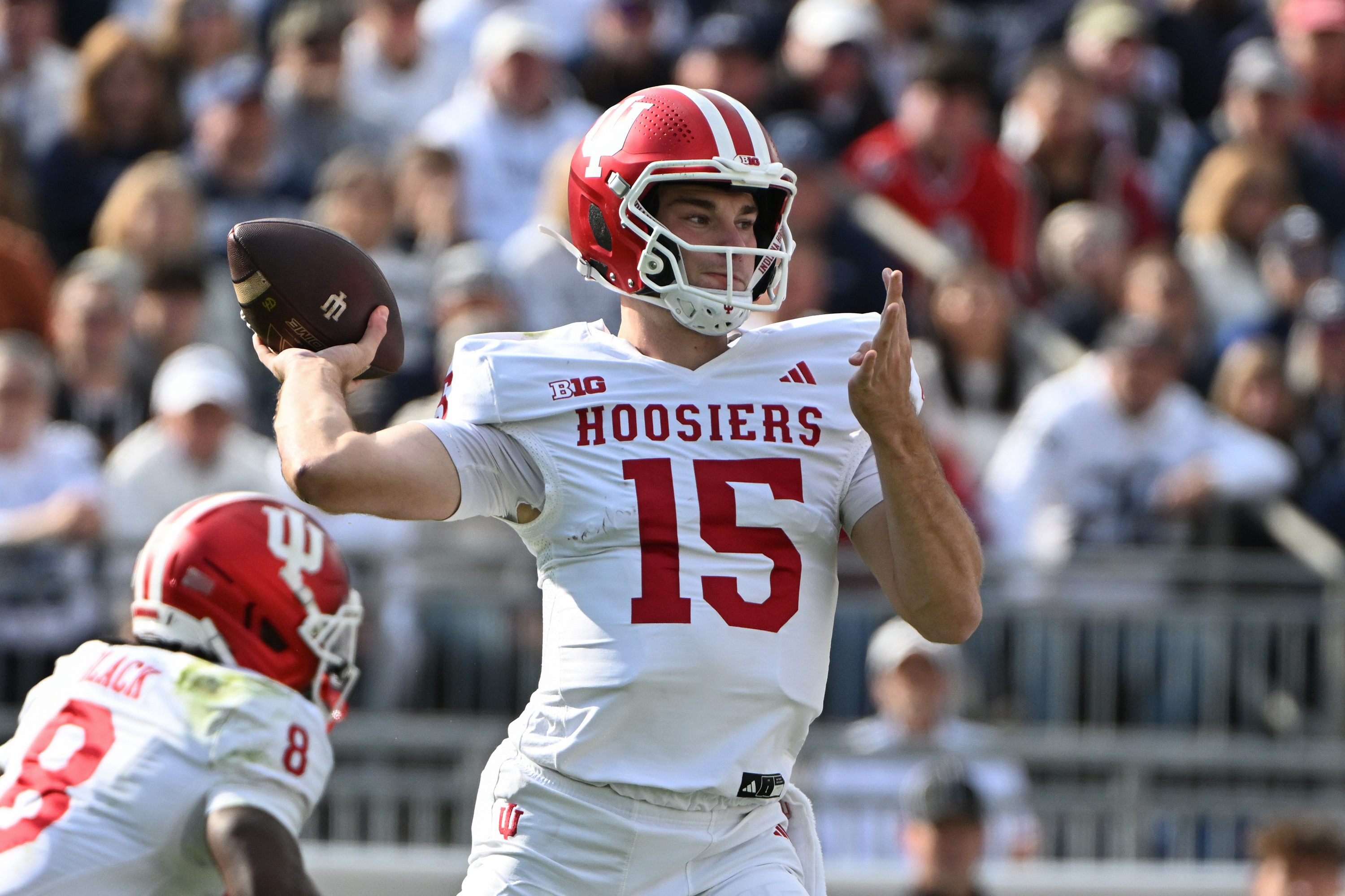 Indiana quarterback Fernando Mendoza (15) looks to pass against Penn State during the first half of an NCAA college football game, Saturday, Nov. 8, 2025, in State College, Pa. (AP Photo/Barry Reeger)