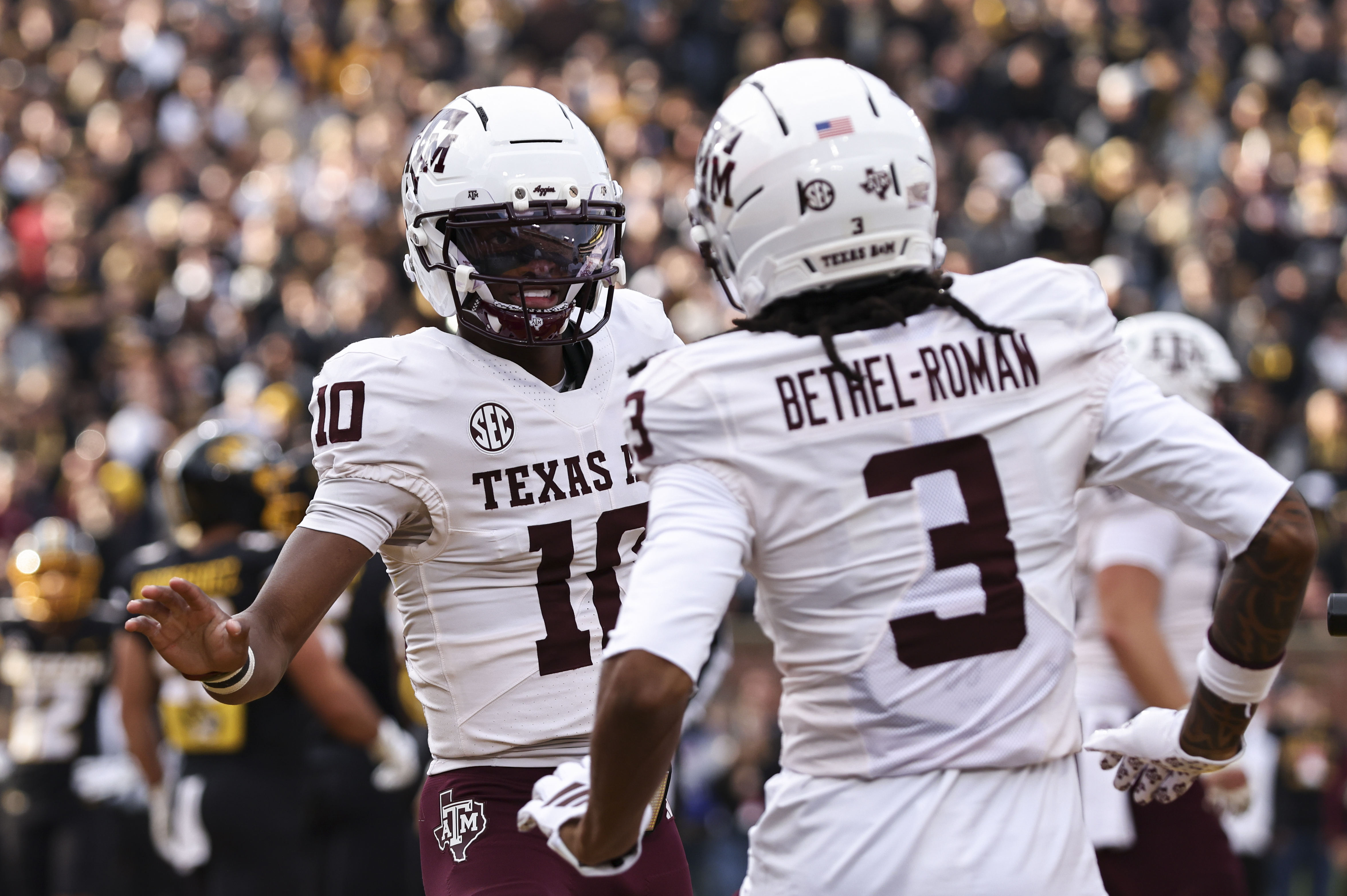 COLUMBIA, MO - NOVEMBER 08: Texas A&M Aggies wide receiver Ashton Bethel-Roman (3) celebrates a touchdown with quarterback Marcel Reed (10) in the first quarter of an SEC football game between the Texas A&M Aggies and Missouri Tigers on November 8, 2025 at Memorial Stadium in Columbia, MO. (Photo by Scott Winters/Icon Sportswire via Getty Images)