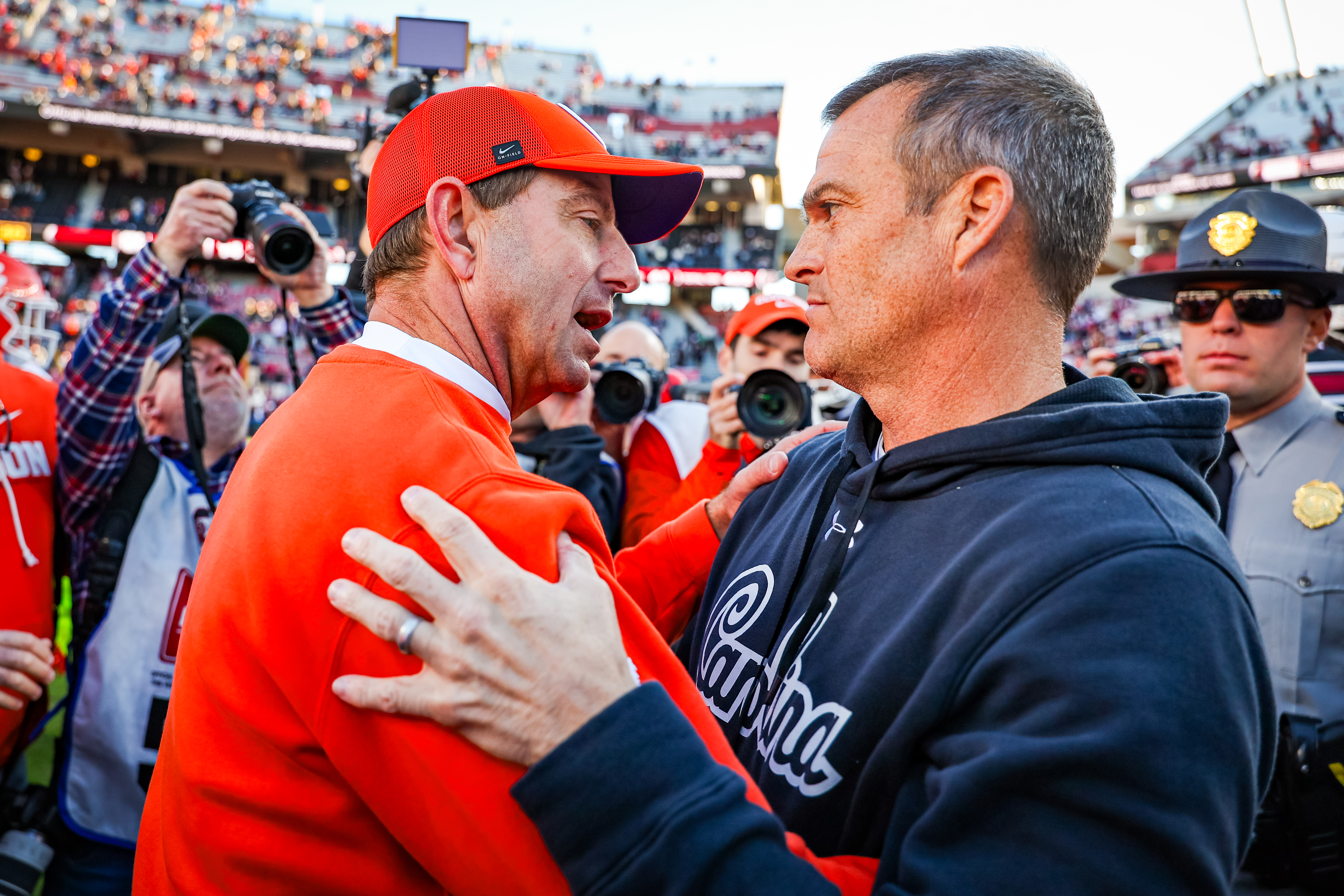 COLUMBIA, SOUTH CAROLINA - NOVEMBER 29: (L-R) Head Coach Dabo Swinney of the Clemson Tigers greets Head Coach Shane Beamer of the South Carolina Gamecocks after the football game at Williams-Brice Stadium on November 29, 2025 in Columbia, South Carolina. (Photo by David Jensen/Getty Images)