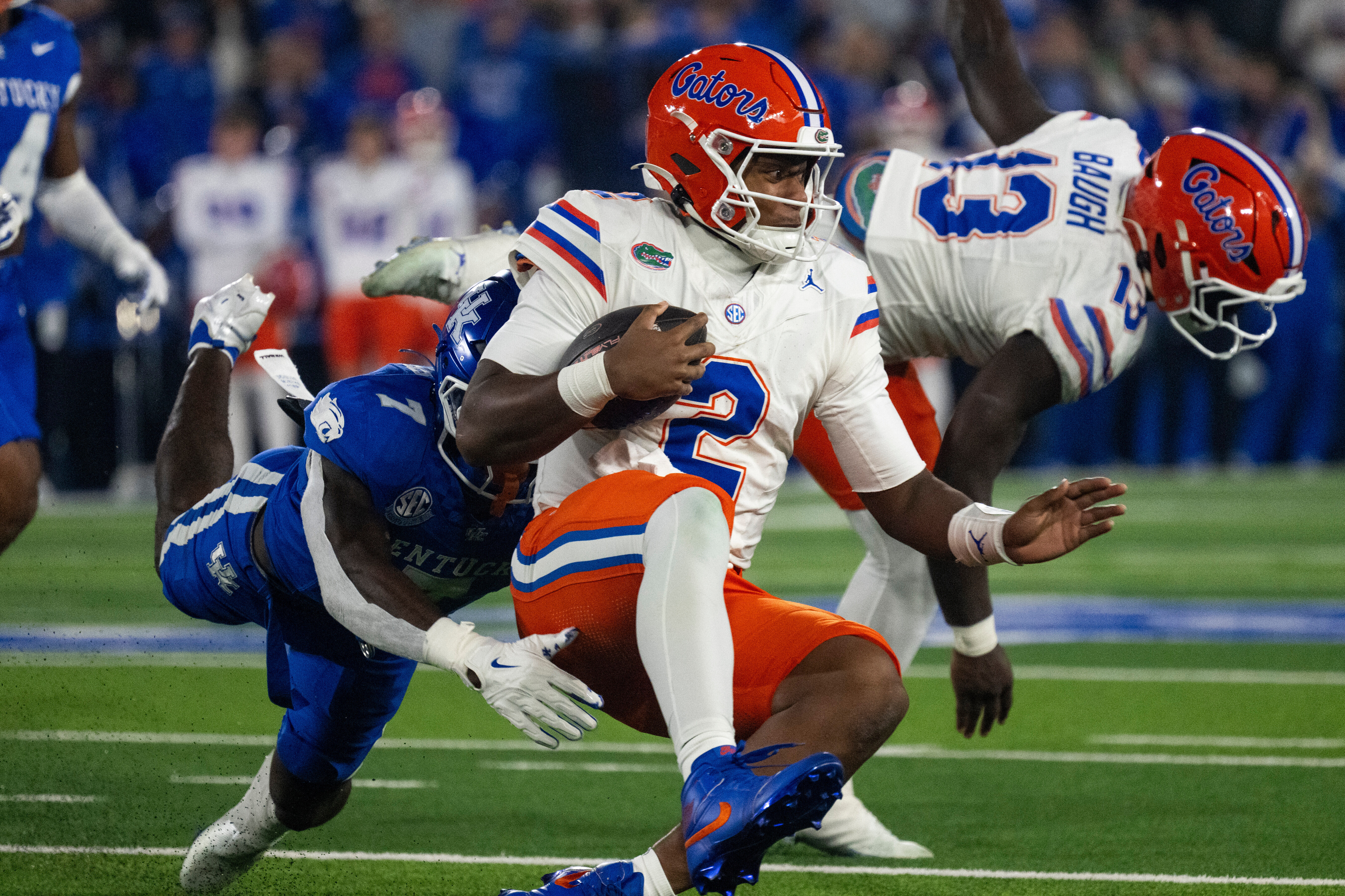 Florida quarterback DJ Lagway (2) slides for a first down in the second quarter of an NCAA college football game against Kentucky, Saturday, Nov. 8, 2025, in Lexington, Ky. (AP Photo/Michael Swensen)