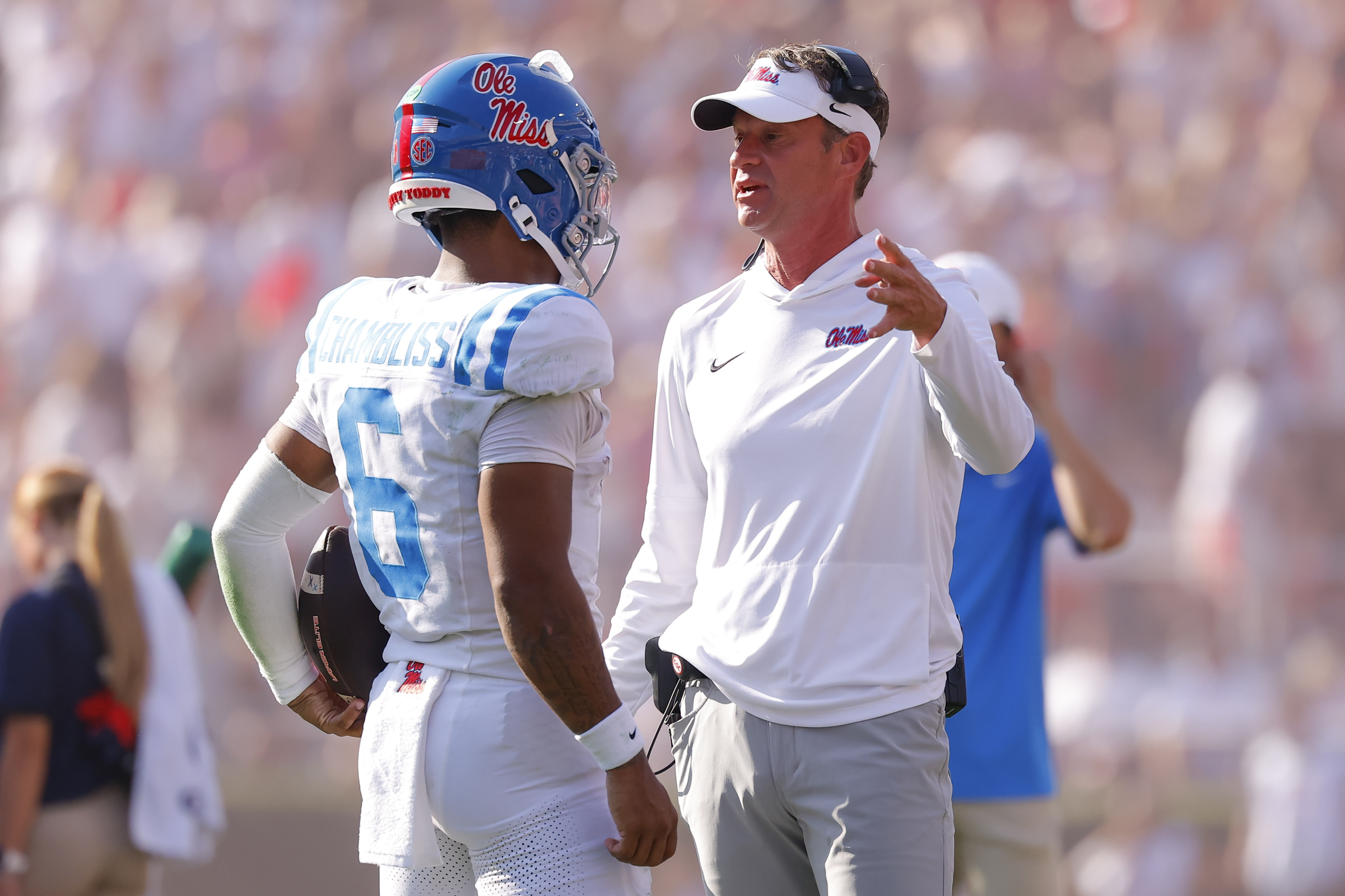 ATHENS, GEORGIA - OCTOBER 18: Head coach Lane Kiffin of the Mississippi Rebels speaks with Trinidad Chambliss #6 during the second quarter against the Georgia Bulldogs at Sanford Stadium on October 18, 2025 in Athens, Georgia. (Photo by Todd Kirkland/Getty Images)