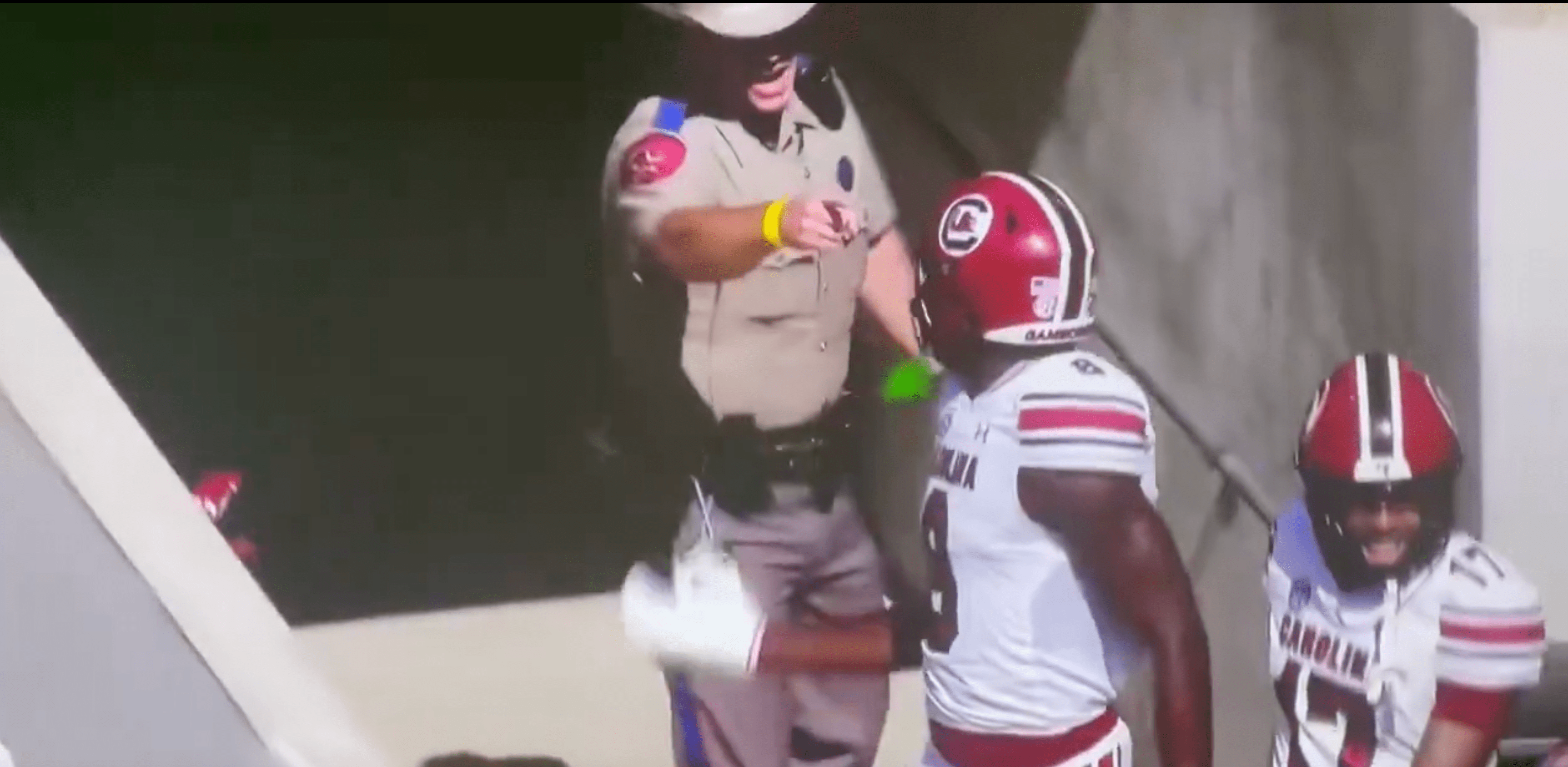 This officer was not happy Nyck Harbor and other South Carolina players had gone up a tunnel after a touchdown. (via ESPN)